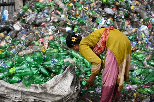 recycling center with workers sorting materials