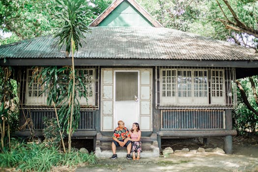 happy couple in front of their solar-powered home