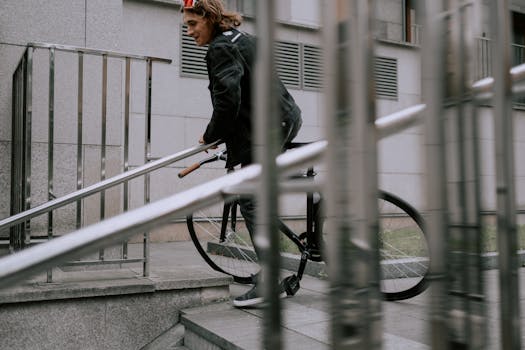 a young adult riding a bike in the city